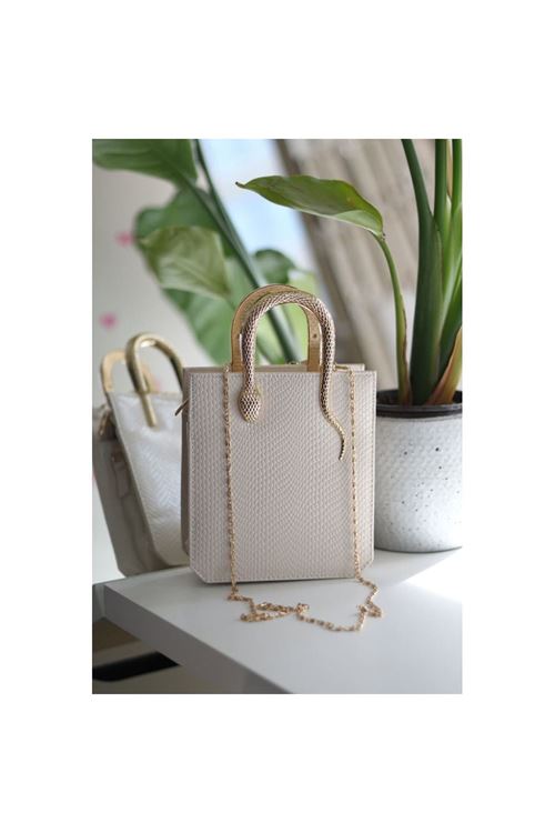 Krem Yılan aksesuar detaylı parlak doku abiye el çantası